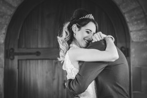 bride & groom hug after saying I Do